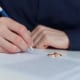 Insight Legal Solutions: husband signing paperwork during divorce without consent